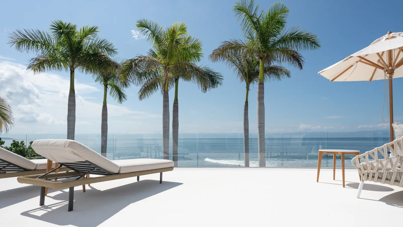 Master Suite 1: loungers on the terrace above the palms