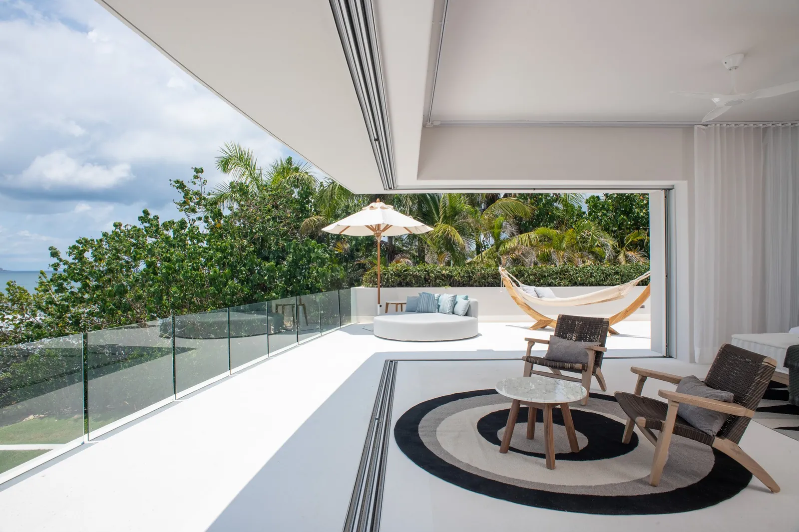 Master Suite 2: the terrace with armchairs and the garden below