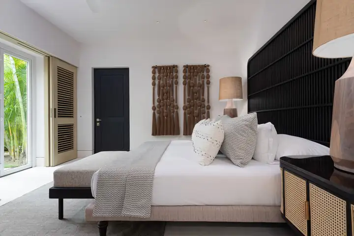 Garden View Suite 6: the king bed and garden doors