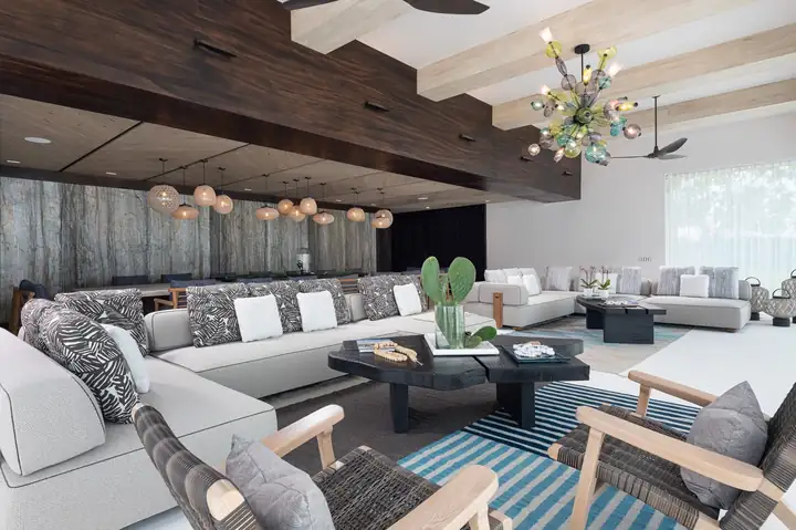 Deep sofas and a sculptural chandelier in the living room