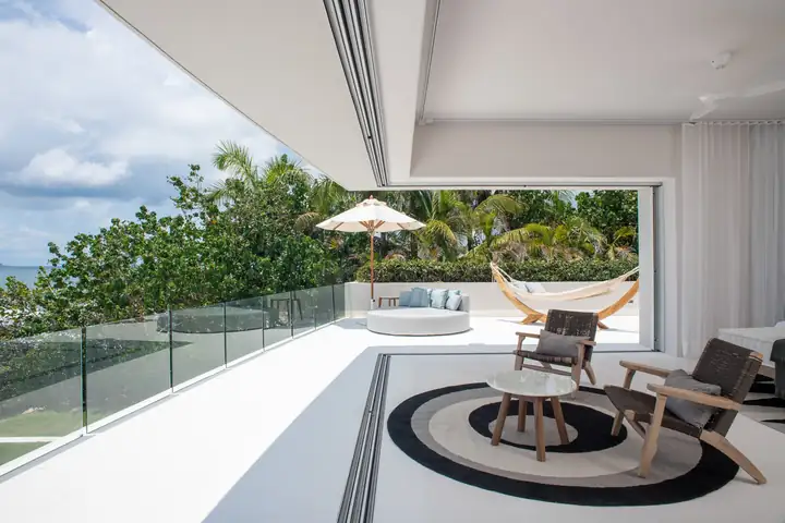 Master Suite 2: the terrace with armchairs and the garden below