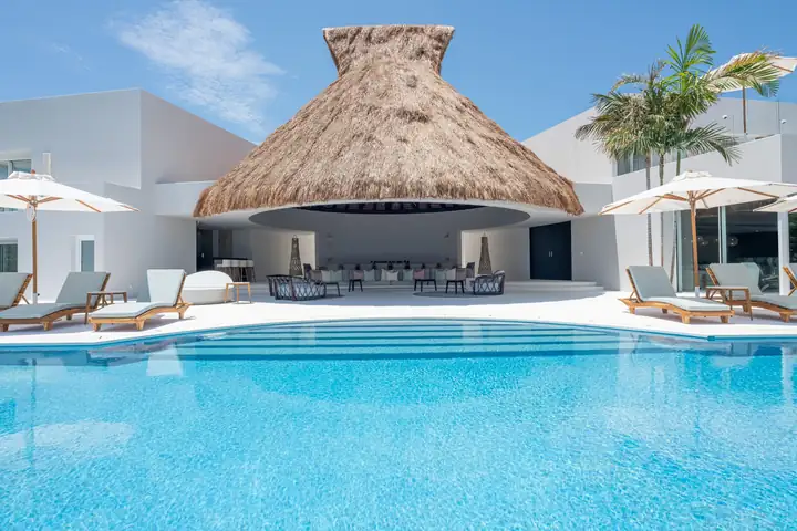 The thatched palapa across the swimming pool